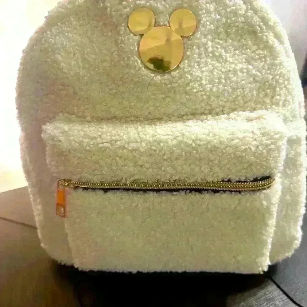Bioworld Disney white sherpa mini backpack.